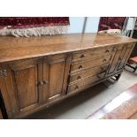 An oak Priory style sideboard