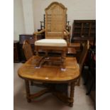 A dining suite, American/English oak with Colonial style parquetry work, comprising table with