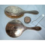A silver covered hairbrush and matching mirror; a sugar tongs; another item