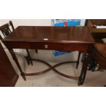 A Regency style inlaid mahogany side table with cross stretcher