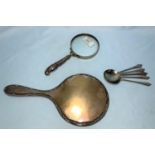 A hallmarked silver handled magnifying glass, s et of 5 hallmarhed silver spoons, 3.6oz, and a