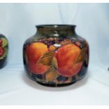 A Moorcroft pottery pomegranite vase of squat form (chip to rim) 15cm