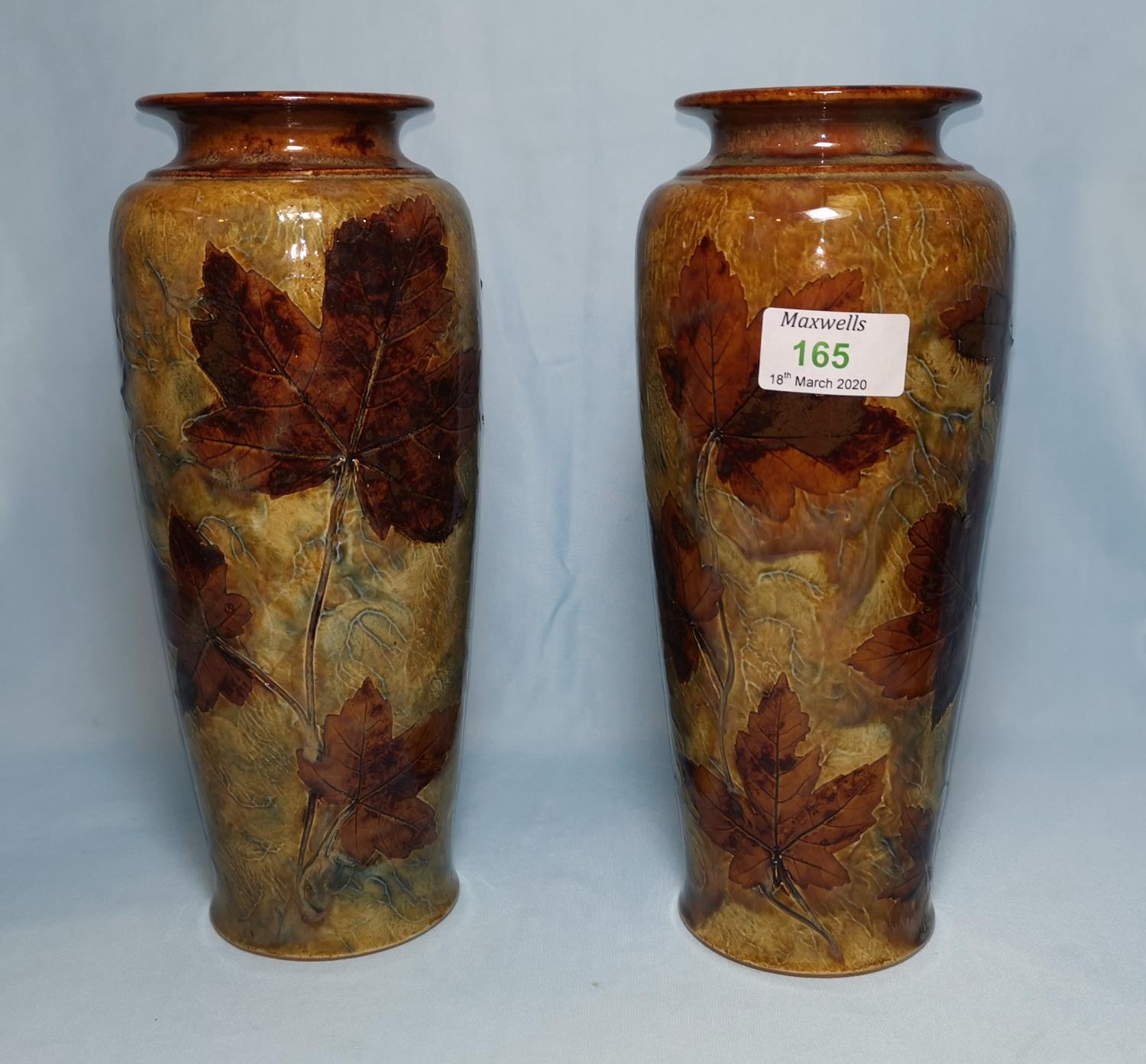 A late 19th century pair of Royal Doulton tapering vases decorated with autumn leaves, impressed