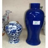 A Chinese porcelain baluster shaped vase, powder blue glaze, 27 cm (rim repaired); a dragon vase, 14