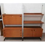 A 1970's pair of full height wall units in teak and white laminate, by Beaver Tapley Ltd "Shelvex"