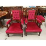 An Edwardian mahogany armchairs and a footstool, upholstered in wine dralon