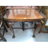 A 1930's mahogany draw leaf dining table on ball and claw feet
