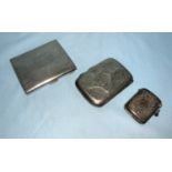 Two silver cigarette cases; a silver vesta case, 5.7 oz