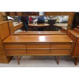 A 1960's teak dressing table with 6 drawers and long mirror