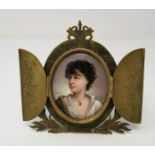 A 19th century Italian porcelain miniature portrait of a Neapolitan girl, in cut and engraved