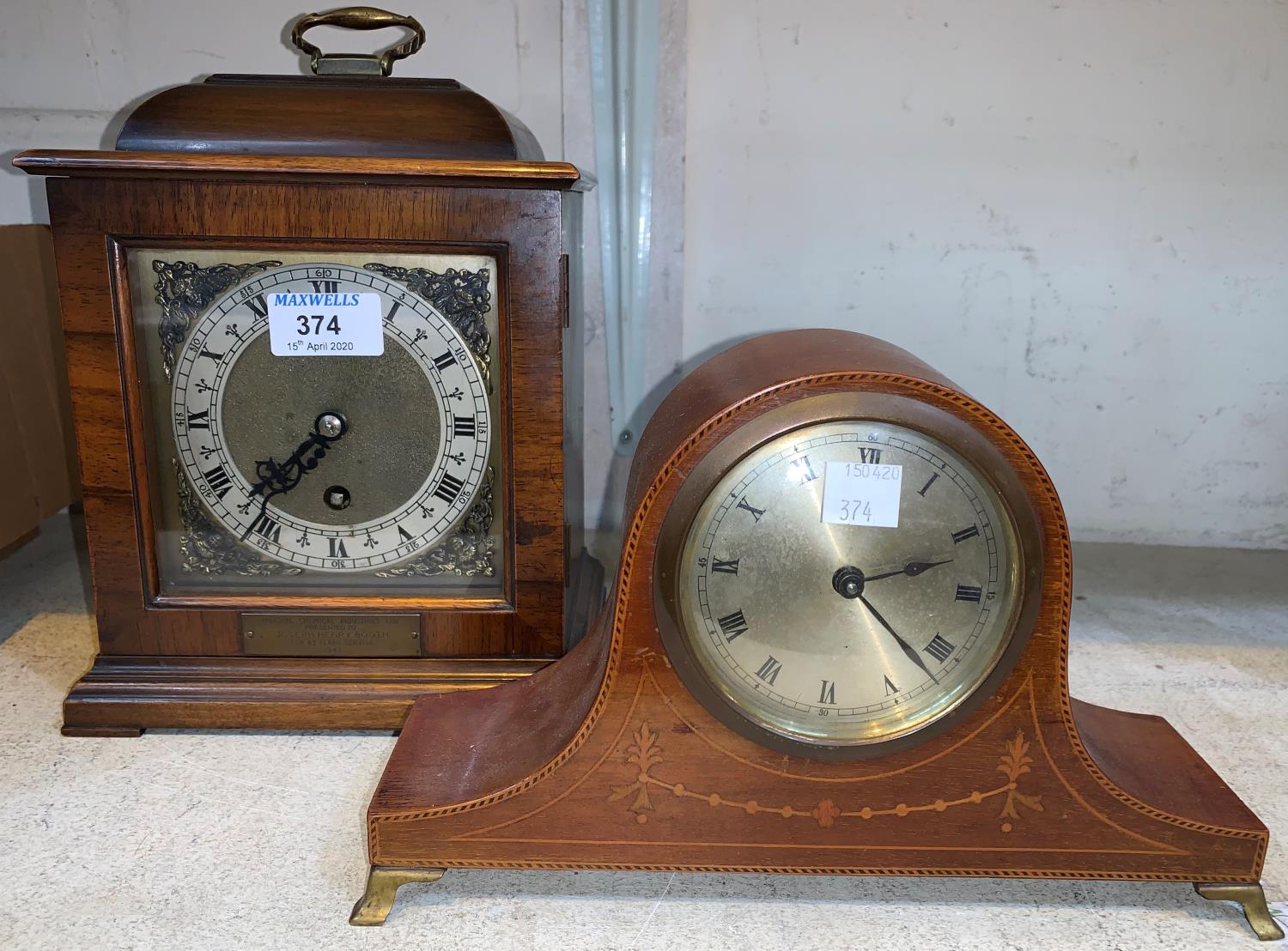 A Georgian style bracket clock in walnut case; an Edwardian mantel clock in inlaid mahogany case