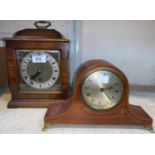 A Georgian style bracket clock in walnut case; an Edwardian mantel clock in inlaid mahogany case