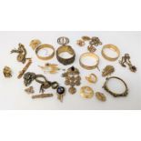 A selection of gilt metal jewellery including bangles, pendants etc