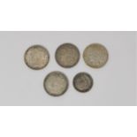 Four US silver dollars: 1879, 1884, 1891 & 1926; a half dollar 1893