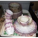 An early 20th century fluted lilac bordered part tea set by Tuscan, approx 34 pieces