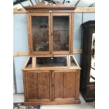 A 19th century pitch pine museum display cabinet, full height, with 2 glazed doors and fall front