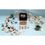 A selection of miniature china figures and trinket ware