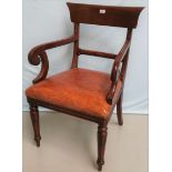 A Regency mahogany carver chair with wide top rail and scroll arms, on turned fluted legs