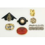 A 19th century brooch set oval banded cornelian in gilt metal mount, 7 cm; 6 other brooches