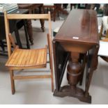 A 1930's oak 2 door display cabinet; a 1930's oak drop leaf dining table on bulbous legs; a