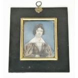 A 19th century half length miniature of a woman with a quizzing glass, 10 x 8 cm, ebonised frame