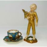 A Royal Worcester figure, 'The Parakeet'; a Coalport cabinet cup and saucer with hand painted