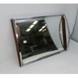 A 1960's mirrored and simulated rosewood tray