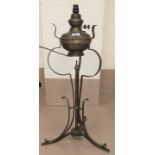An Edwardian Art Nouveau table oil lamp of wrought brass construction, tripod base, 68cm (