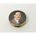 A powder box depicting portrait of man in suit