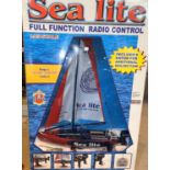 An originally boxed 'Sea Lite' radio controlled yacht and 2 x 1970's vintage boxed games