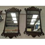 A pair of late 19th century Chippendale style wall mirrors in oak fretwork frames