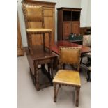 A 1930's D end drop leaf oak dining table and a set of four Cromwellian style dining chairs with