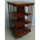 An Edwardian 3 height revolving bookcase in stained wood, height 111 cm
