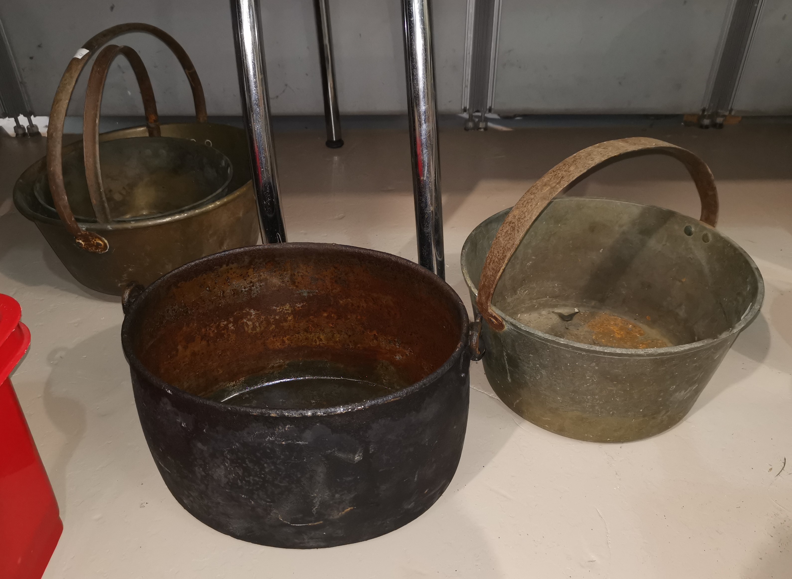 Three 19th century jam pans; an oval pan