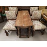 A Titchmarsh & Goodwin drop leaf dining table and four dining chairs upholstered in floral fabric