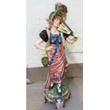 A late 19th century continental majolica figure of a young woman with a fan, 100 cm (restored)