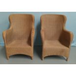 A modern pair of woven cane armchairs