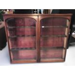 A Victorian mahogany wall display unit enclosed by 2 arched glazed doors, width 132 cm, height 110