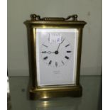 A 19th century brass carriage clock with white enamel dial, by Johnson, Preston, 14.5cm