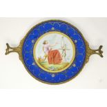 A 19th century continental porcelain dish decorated in enamels with plein air scene of a young woman