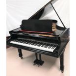 A boudoir grand piano, iron framed and overstrung, on square legs and castors, by C Bechstein,