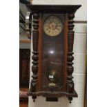 A Victorian Vienna wall clock in walnut case, with striking spring driven movement