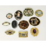 A selection of 19th/20th century decorative costume brooches including amethyst, turquoise, agate