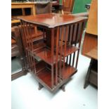 An Edwardian revolving mahogany bookcase