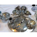 A silver plated 3 piece tea set; an oval gallery tray; an ornate muffin dish; other silver plate