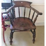 A 19th century elm and beech smoker's bow armchair