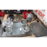 An "English Pewter" 4 piece beaten tea set; 2 large pewter plates; a pewter framed mirror