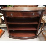 A Regency style inlaid mahogany bookcase with frieze drawers and shelves under; A Victorian mahogany