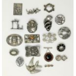 A selection of decorative Art Nouveau period / style white metal brooches