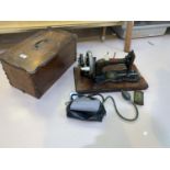 A Victorian Jones hand operated sewing machine in inlaid case; a vintage blood pressure set